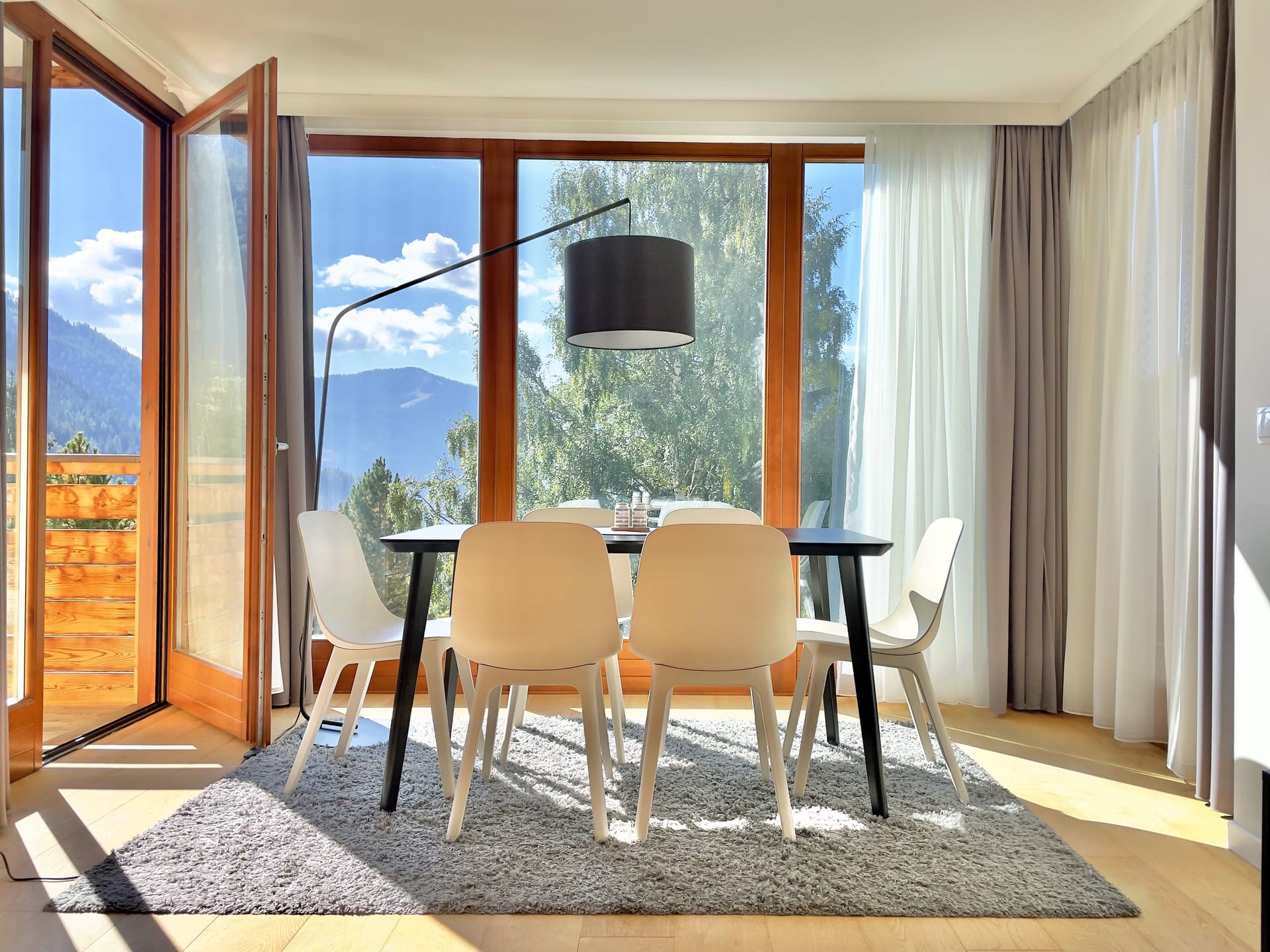 The dining room and balcony at Sunshine @ Rosie, looking south on a sunny morning.