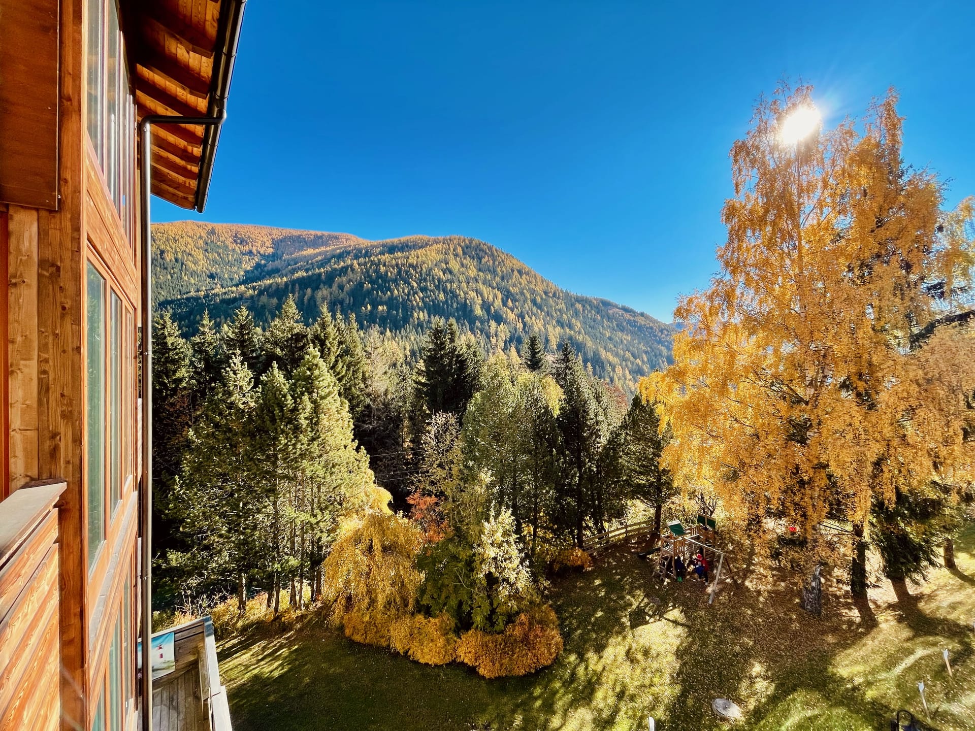 The view from the south-facing balcony in the late afternoon, mountains opening up.