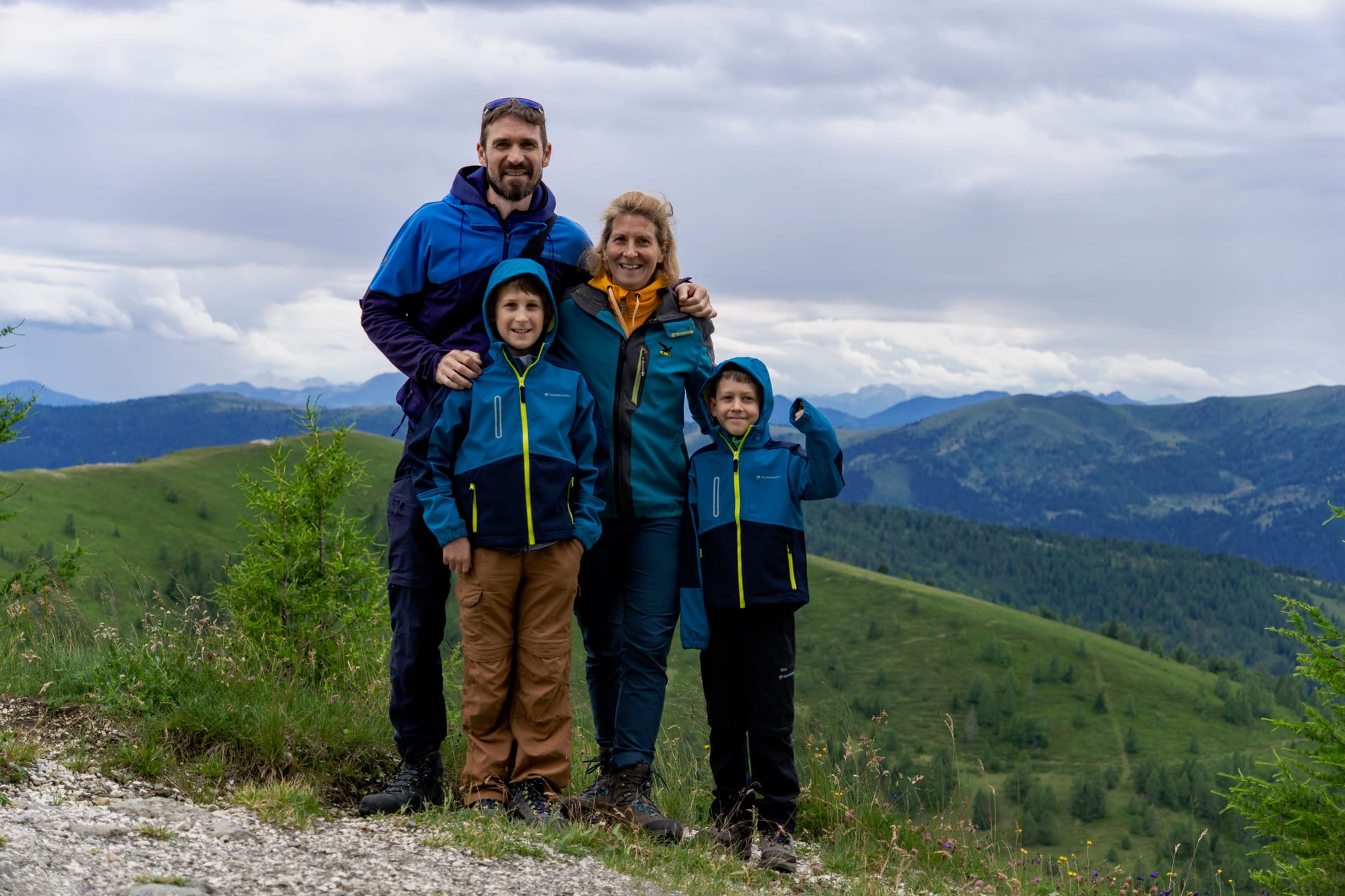 Daniela and Andrey with their family in the mountains.